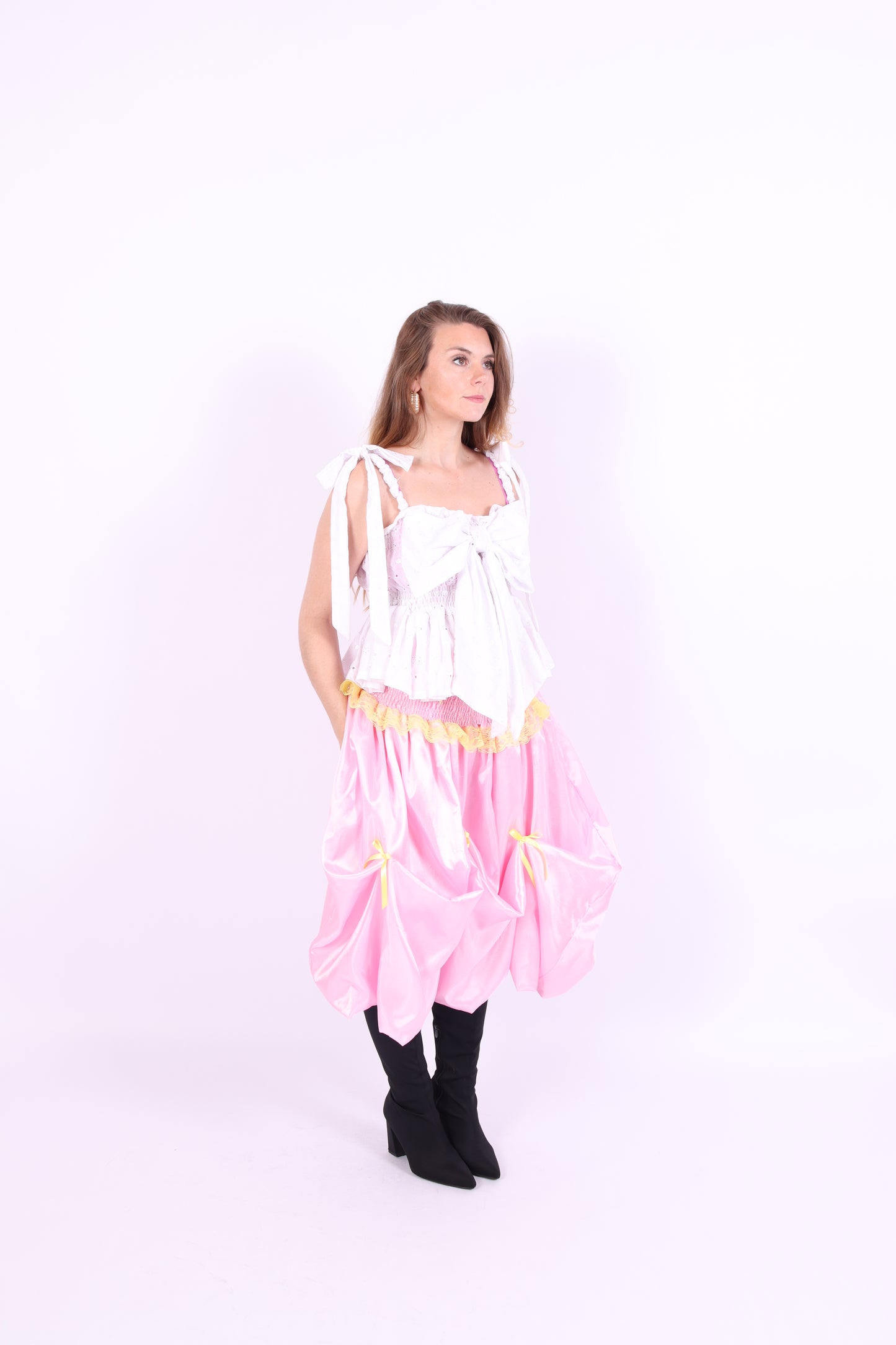 White broderie anglaise bow top with shoulder straps and bust detail, elasticated waist and ruched straps. Delta Of Phoenix Gypsy Bow Top