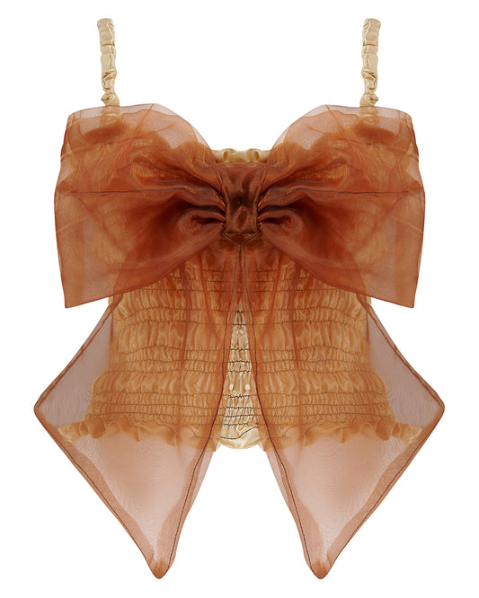 A gold satin top with an elasticated shirring bodice and a terracotta brown organza bow on the front. It features shoulder straps with elasticated and ruched details. Delta Of Phoenix Naomi Bow Top