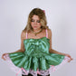 A pistachio green taffeta top with pink scalloped lace detail and a bow on the front, featuring pink topstitch elasticated shirring bodice and baby pink taffeta shoulder straps with rosette detail. Delta Of Phoenix Göta Bow Top