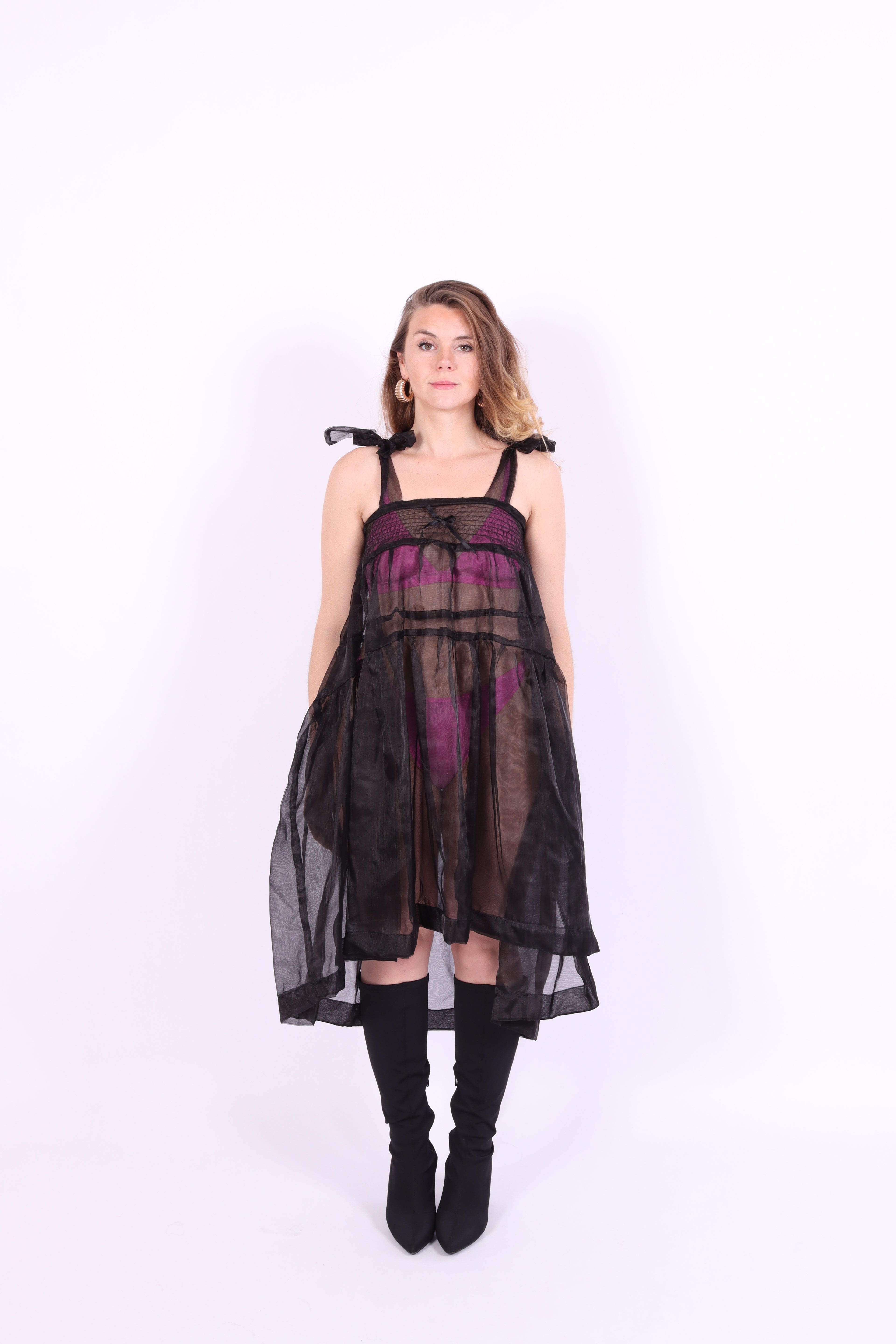 Black organza waterfall dress with a flowing full skirt, organza bow shoulder straps, and an elasticated shirring panel across the top bodice. Delta of phoenix buffy 2.0 dress