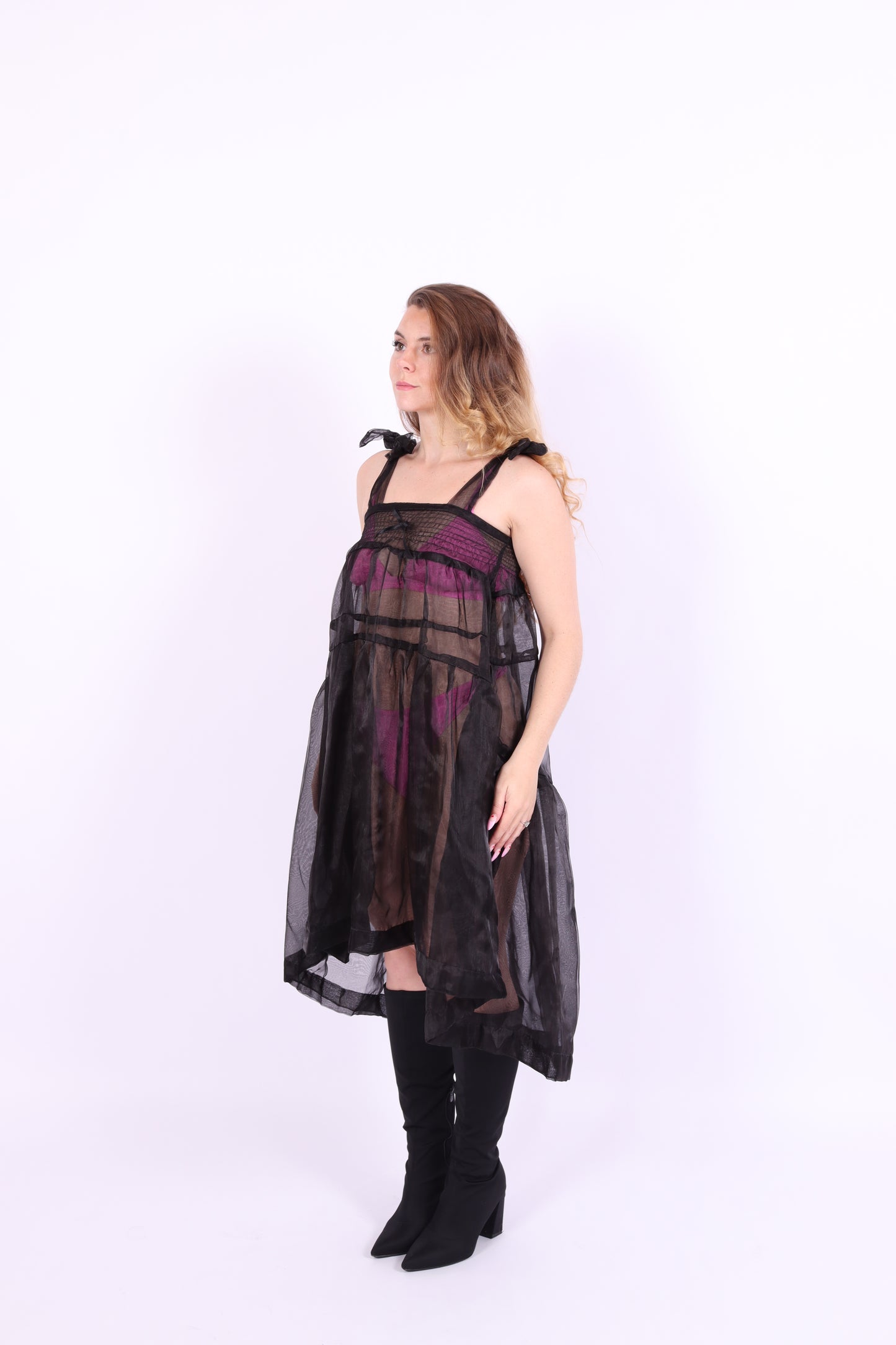 Black organza waterfall dress with a flowing full skirt, organza bow shoulder straps, and an elasticated shirring panel across the top bodice. Delta of phoenix buffy 2.0 dress
