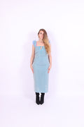 A blue glitter cocktail dress with ruffle detailing, elasticated ruched straps, and a ribbon bow keyhole detail at the front. Delta Of Phoenix Juni Midi Dress