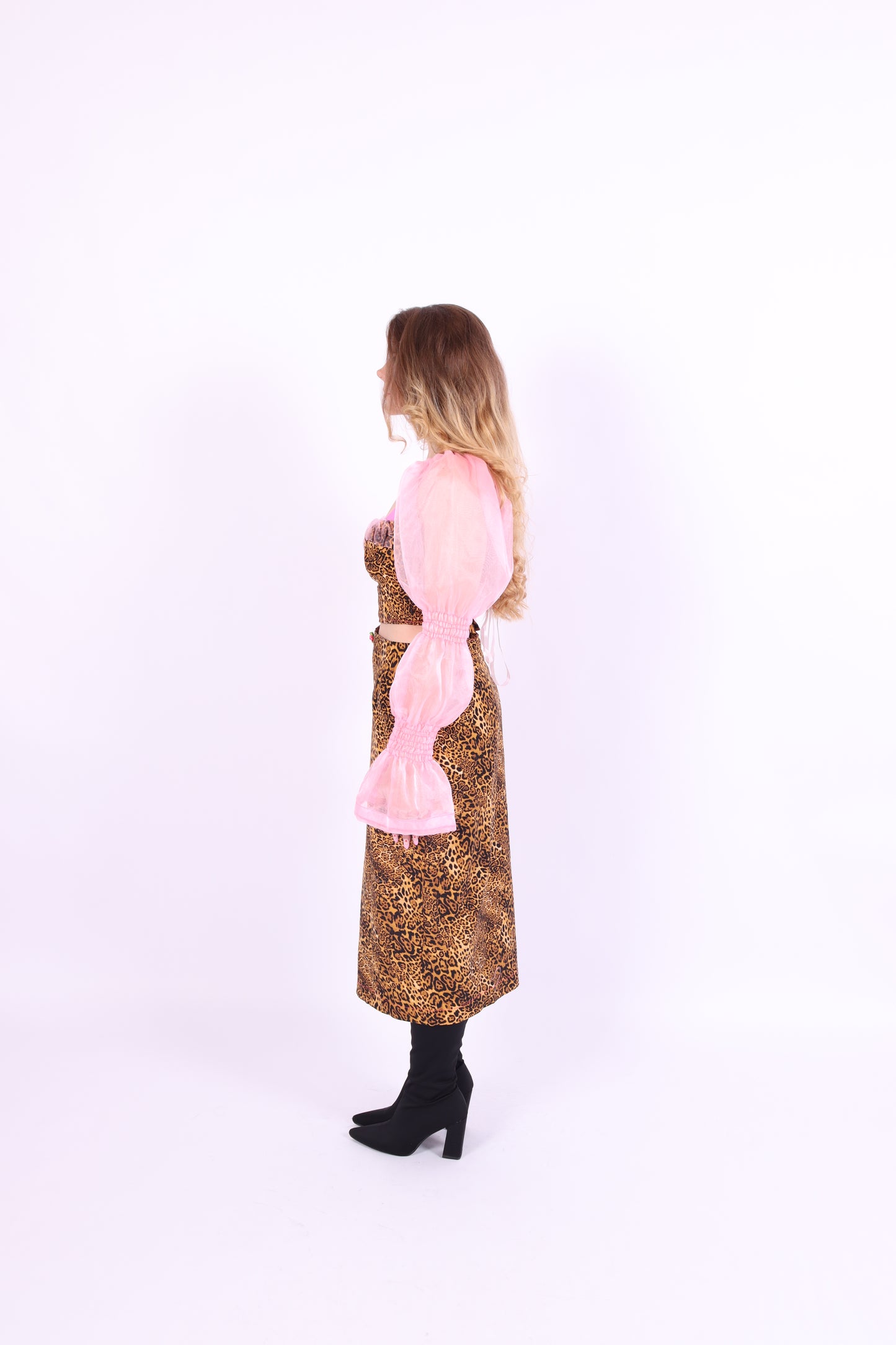 A luxury leopard print corset top with bubblegum pink organza sleeves and rosette detailing, primarily designed as a crop top. Delta Of phoenix Francine Corset Top