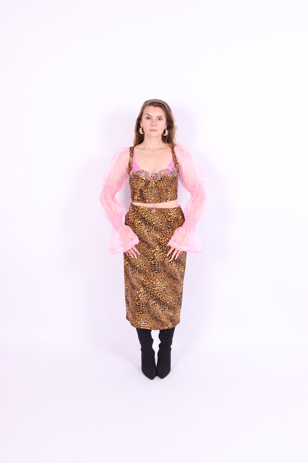 A luxury leopard print corset top with bubblegum pink organza sleeves and rosette detailing, primarily designed as a crop top. Delta Of phoenix Francine Corset Top
