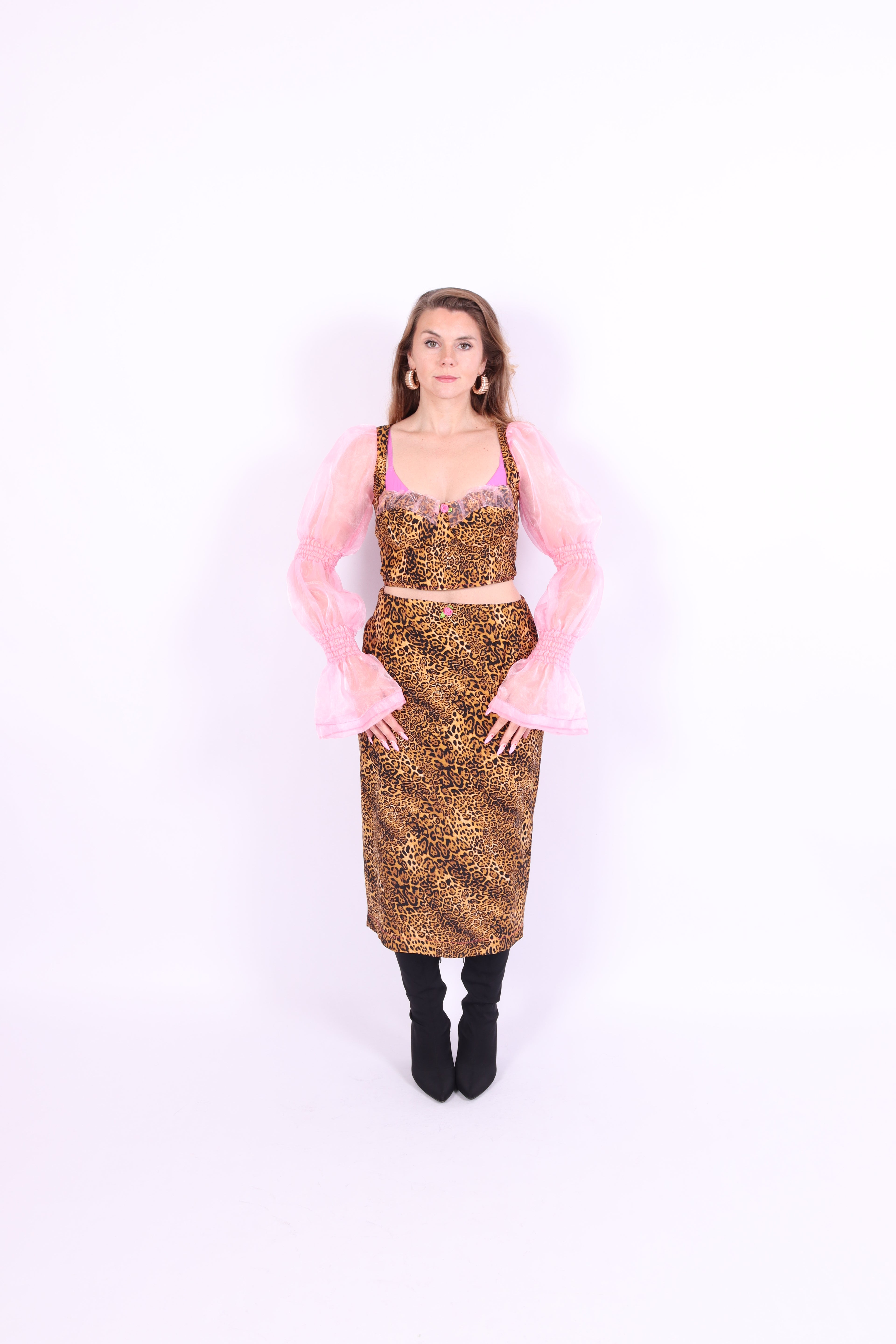 A luxury leopard print corset top with bubblegum pink organza sleeves and rosette detailing, primarily designed as a crop top. Delta Of phoenix Francine Corset Top