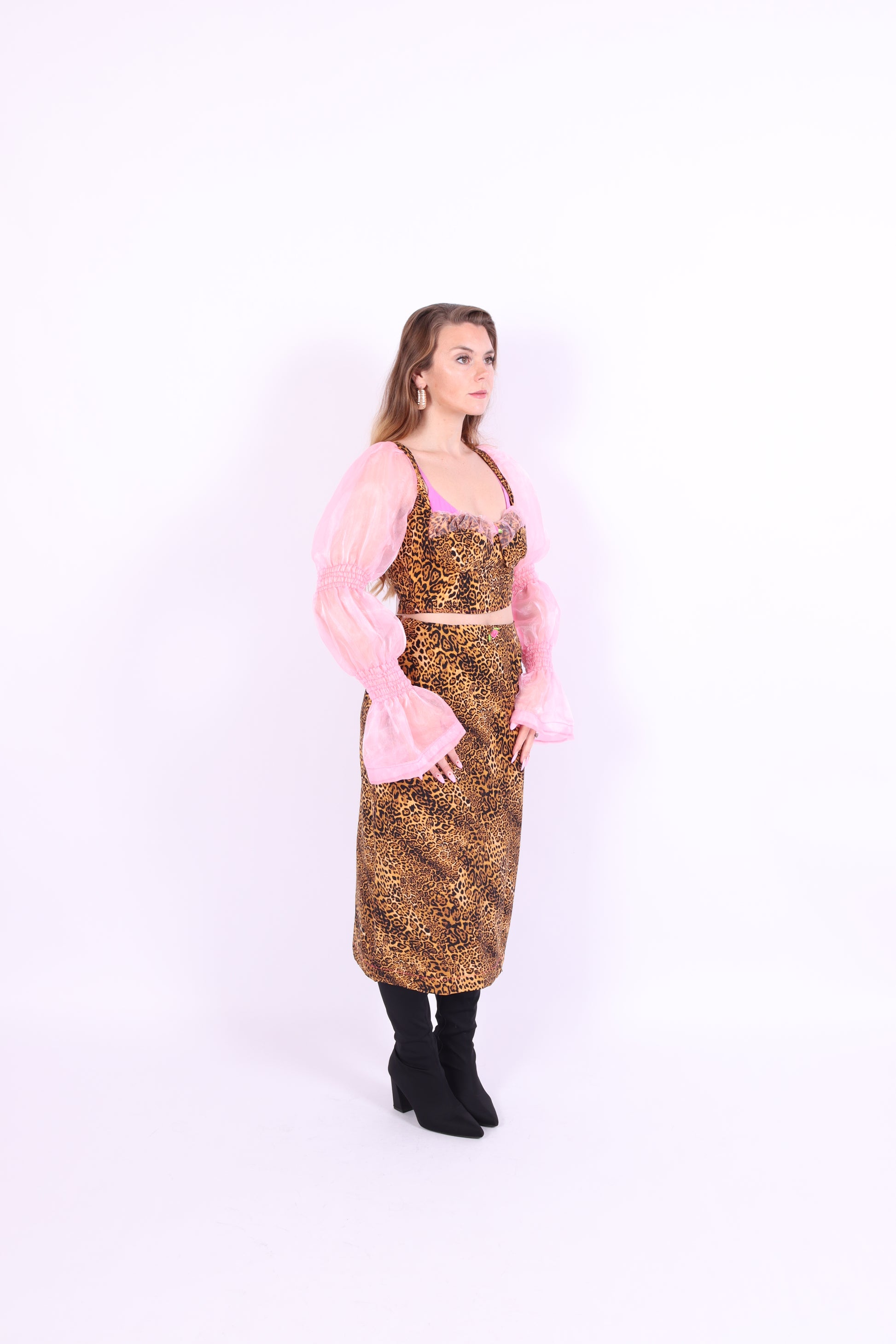 A leopard print midi skirt with pink rosette detailing at the waist, fastened with an invisible side zip. Delta Of phoenix Francine Midi Skirt