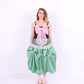 A black satin top with an elasticated shirring bodice and a large bubblegum pink organza bow on the front. It features elasticated shoulder straps with ruched detailing and is displayed against a plain background. Delta Of Phoenix Georgette Bow Top